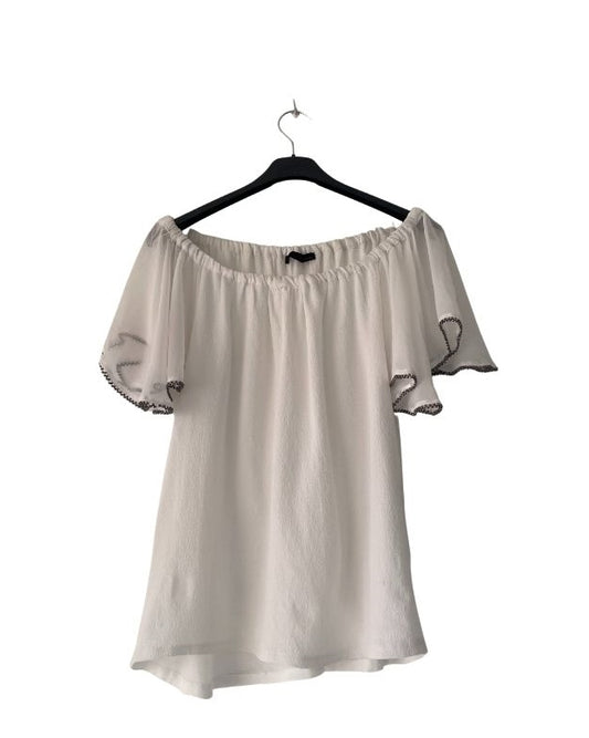 Camisa blanca con mangas volante. COD T7